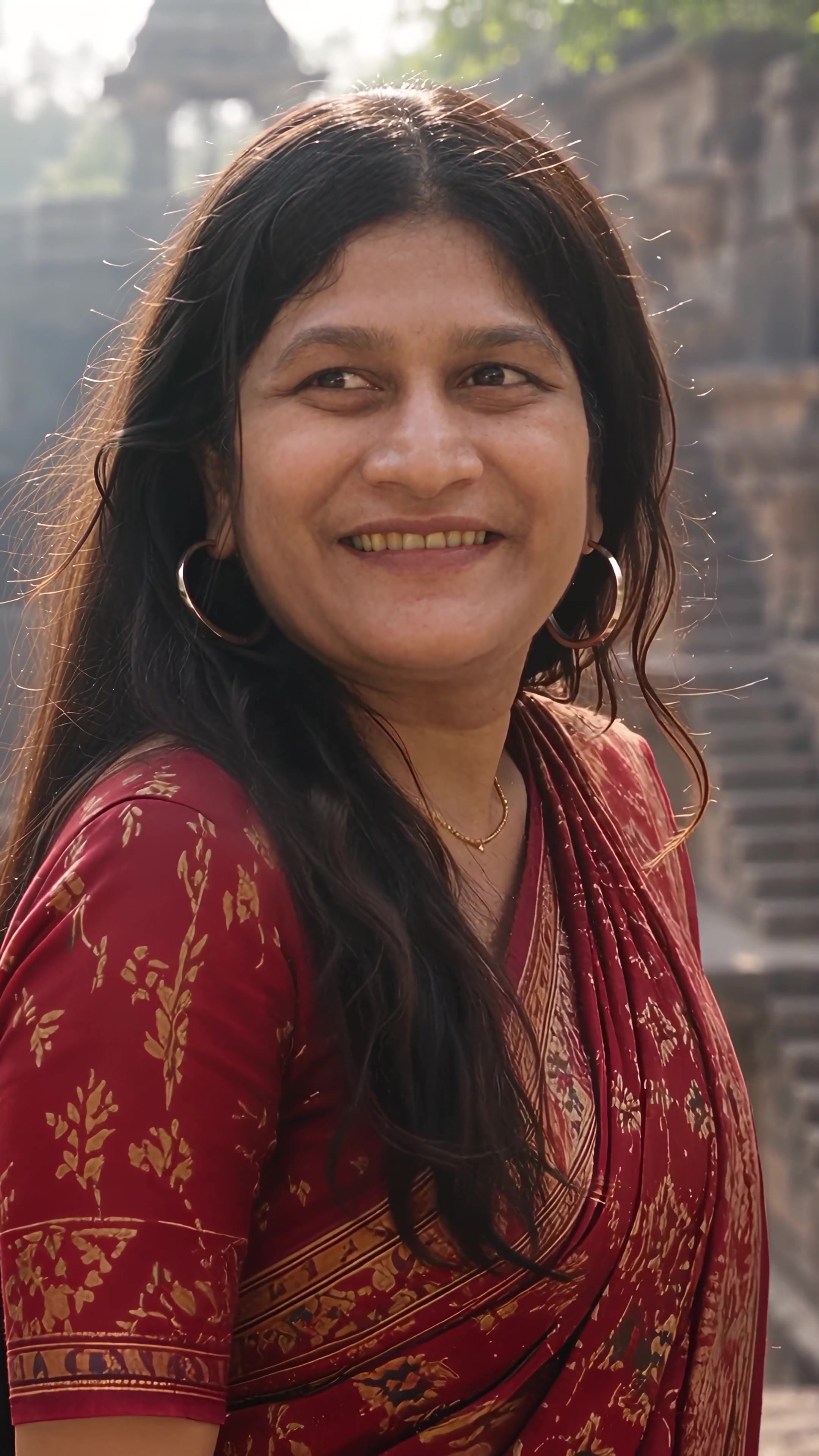 Tu Jaane Na Tu: a woman in a red patola saree climbing the carved steps of an ancient stepwell turns back and smiles